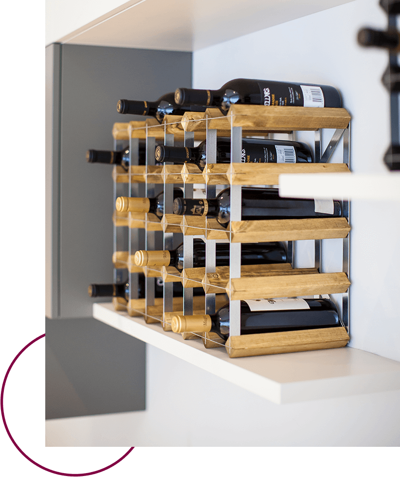 Traditional wine rack on a shelf with wine bottles in